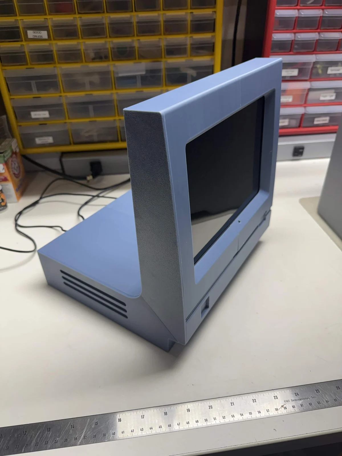 Ron's blue-gray 3D-printed retro Mac enclosure on his workbench